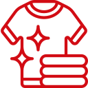 Icon of a clean t-shirt with sparkling stars above a stack of folded clothes, depicted in red lines.